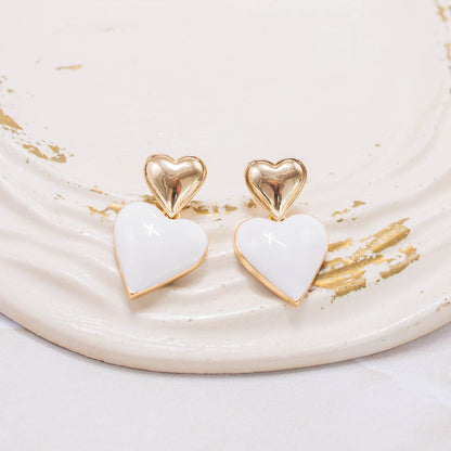 Arete corazón blanco