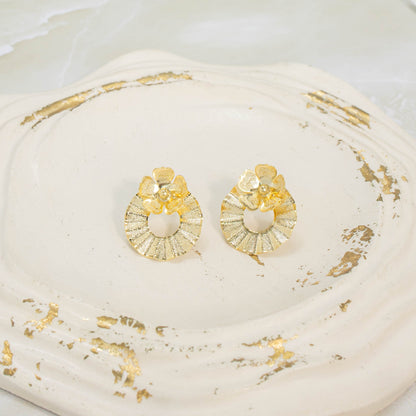 Arete bronce círculo flor Amulí