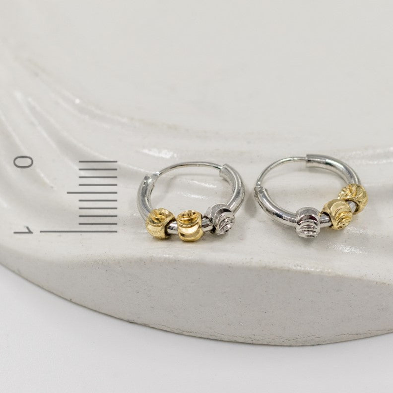 Candonga pequeña dije balines dos oros (1cm)