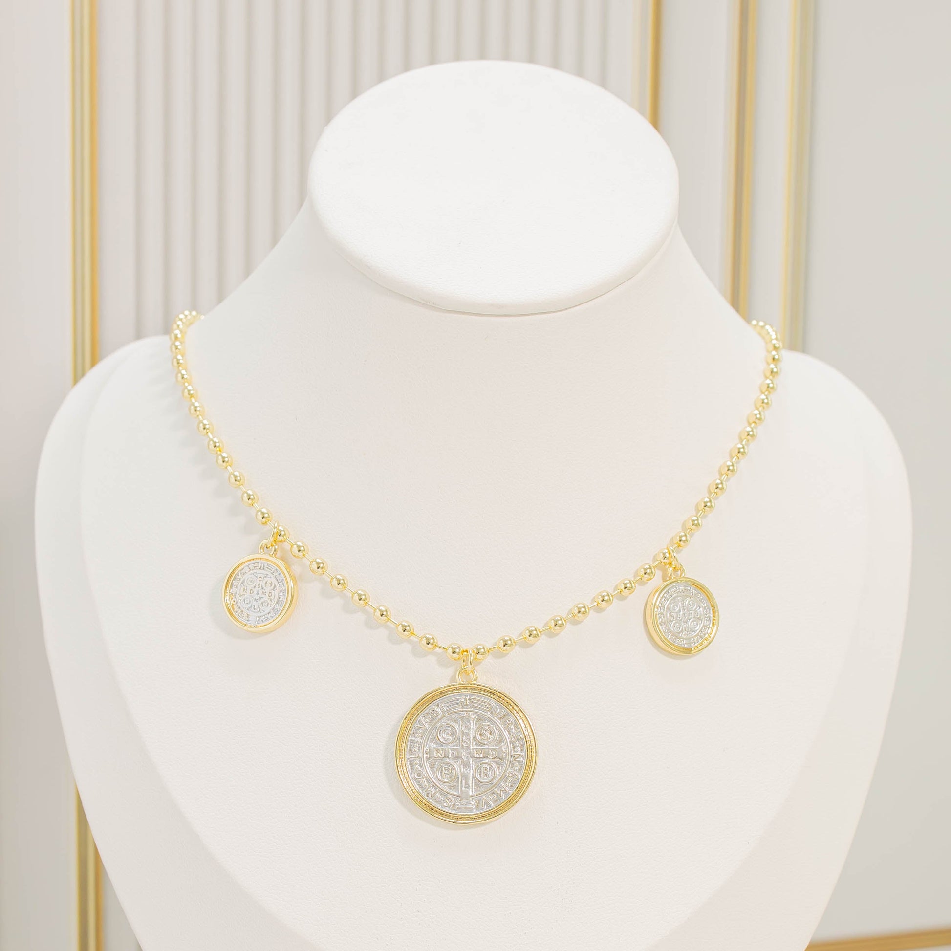 Dúo dijes san Benito