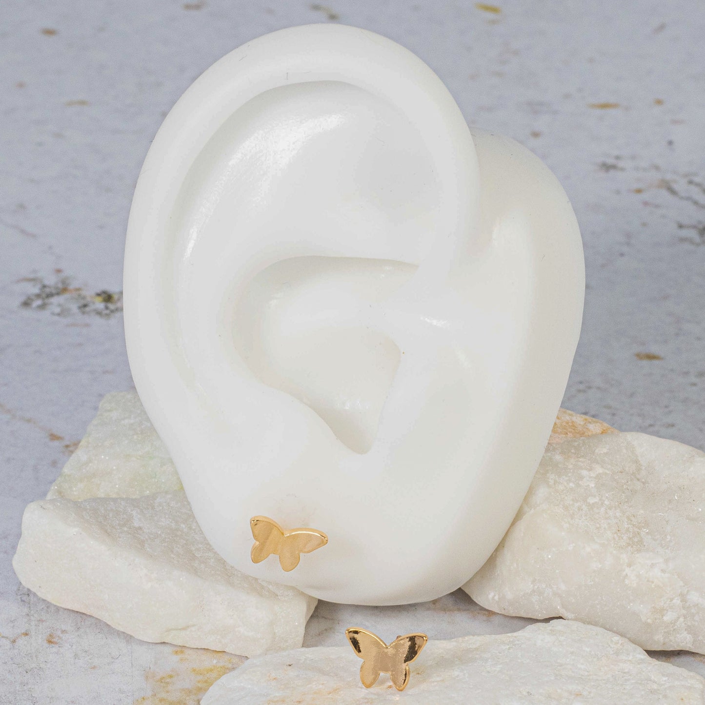 Topo mariposa cóncava 