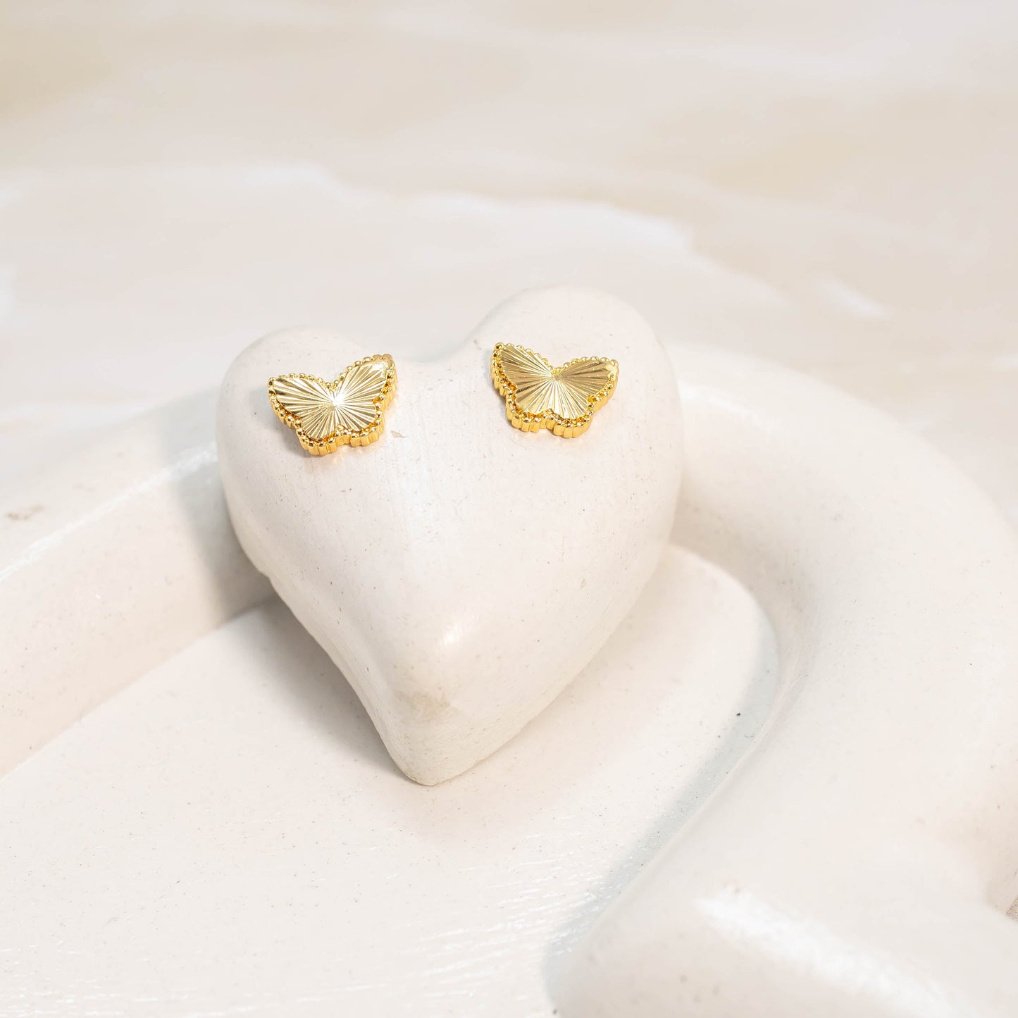 Topo mariposa diamantada